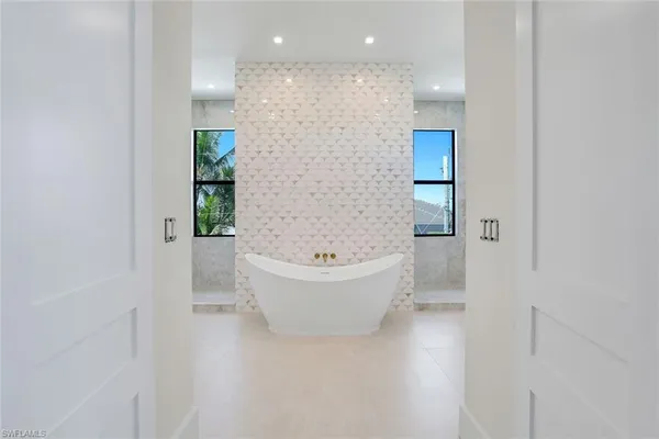 a bathroom with a bathtub and shower