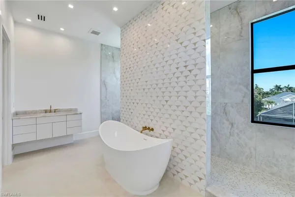 a bathroom with a bathtub sink and toilet