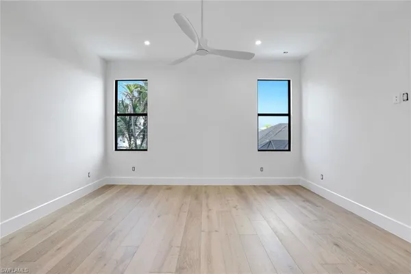 a bathroom with a shower sink mirror and toilet