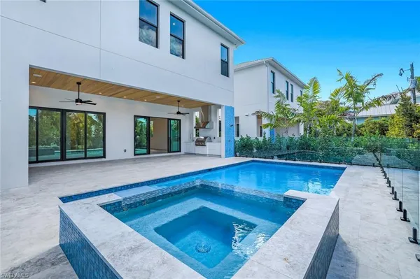 a view of a swimming pool with a patio