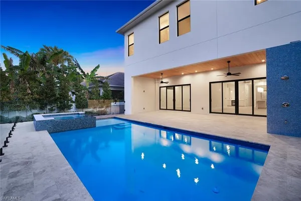 a view of a swimming pool with a patio