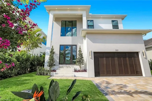 a view of house with a swimming pool