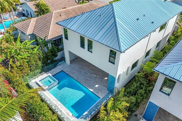 an aerial view of a city and lake view
