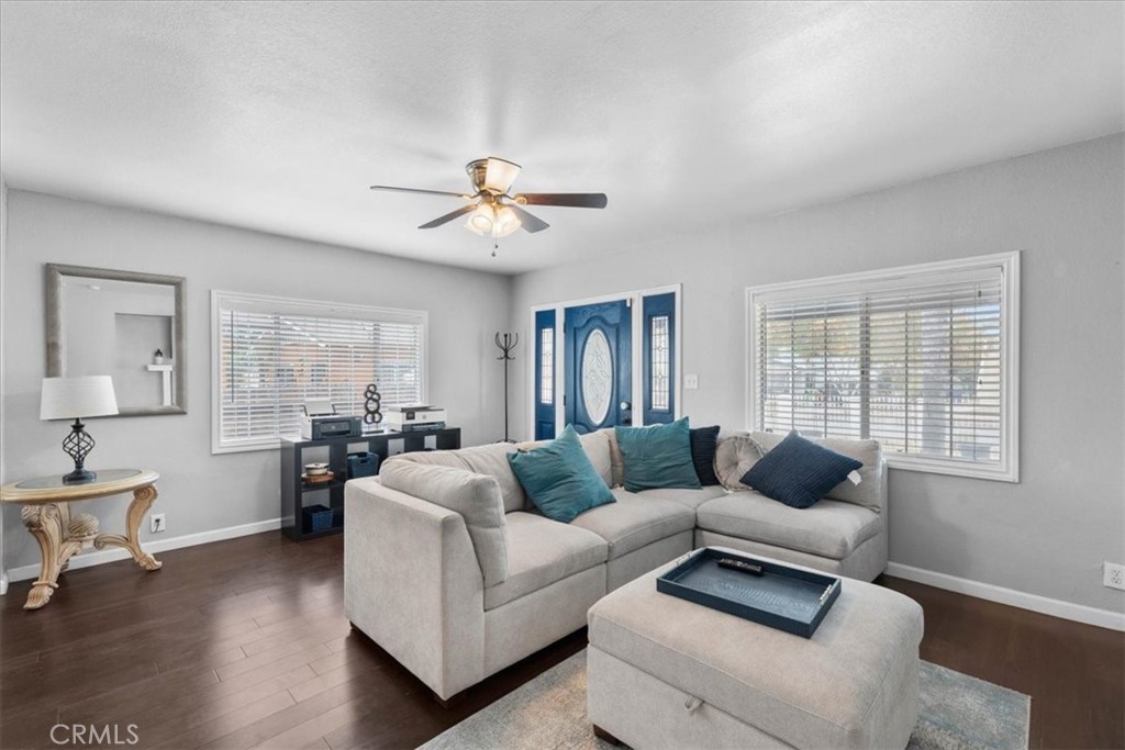 3974 5th Street Riverside, CA 92501 - Photo 11 of 45 a living room with furniture and wooden floor