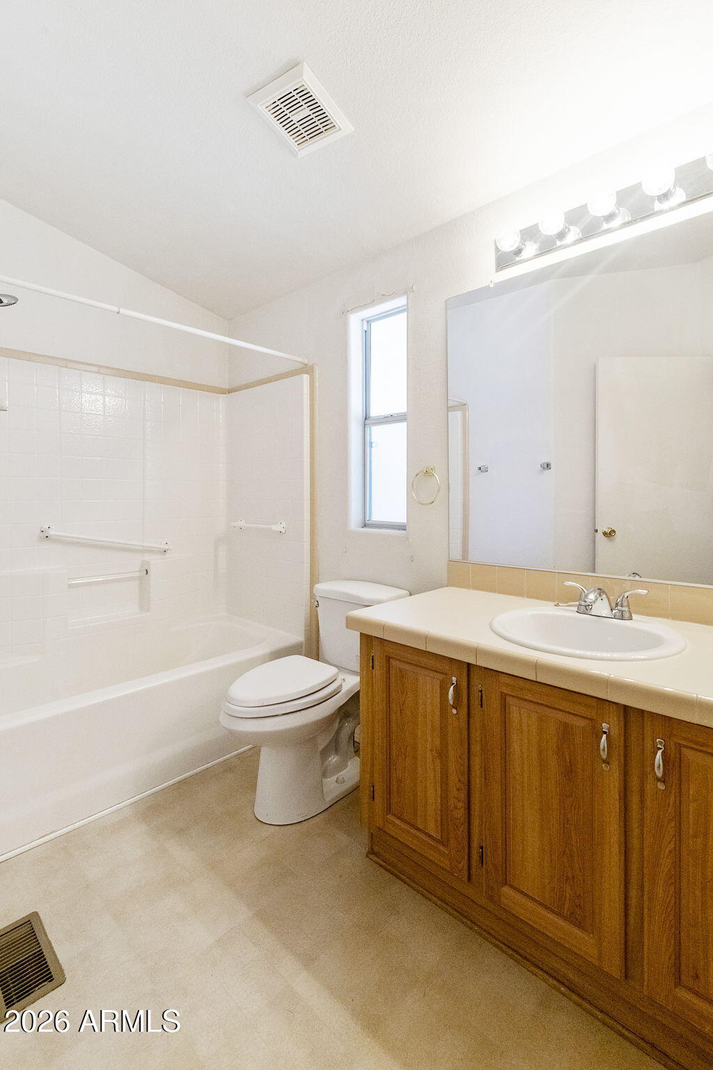 3700 South Tomahawk Road, Unit 73 Apache Junction, AZ 85119 - Photo 7 of 49 a spacious bathroom with a double vanity sink toilet and a bathtub