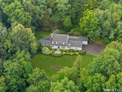 an aerial view of a house with a garden