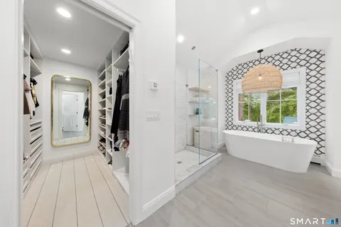 a view of a hallway with washer and dryer