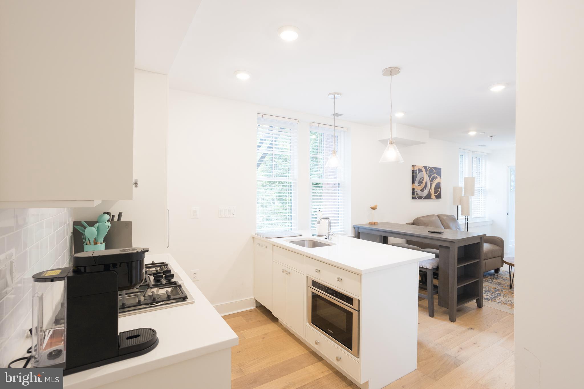 2869 28th Street Northwest, Unit 1 Washington, DC 20008 - Photo 13 of 19 a kitchen with a stove and a sink