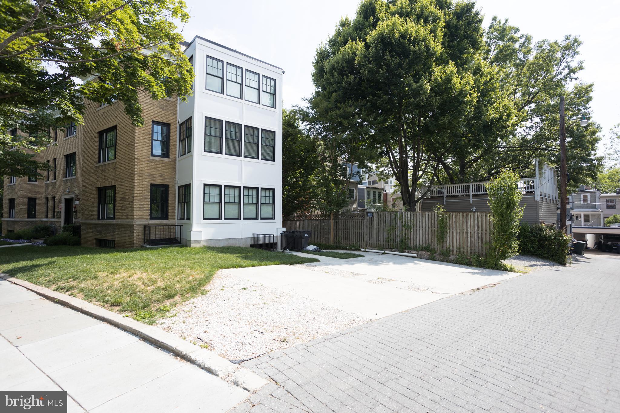2869 28th Street Northwest, Unit 1 Washington, DC 20008 - Photo 2 of 19 a view of a brick house with a large trees