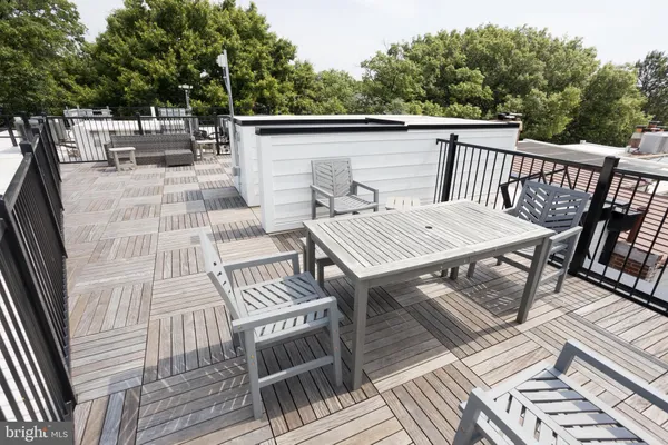 a view of a patio with wooden floor