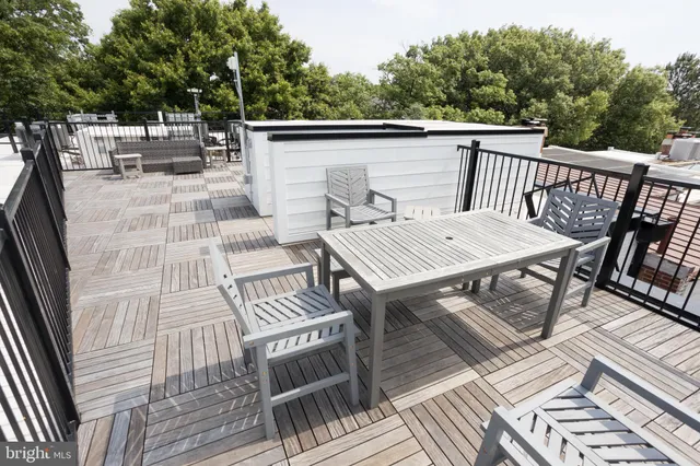 a view of a patio with wooden floor
