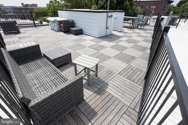 swimming pool view with a seating space