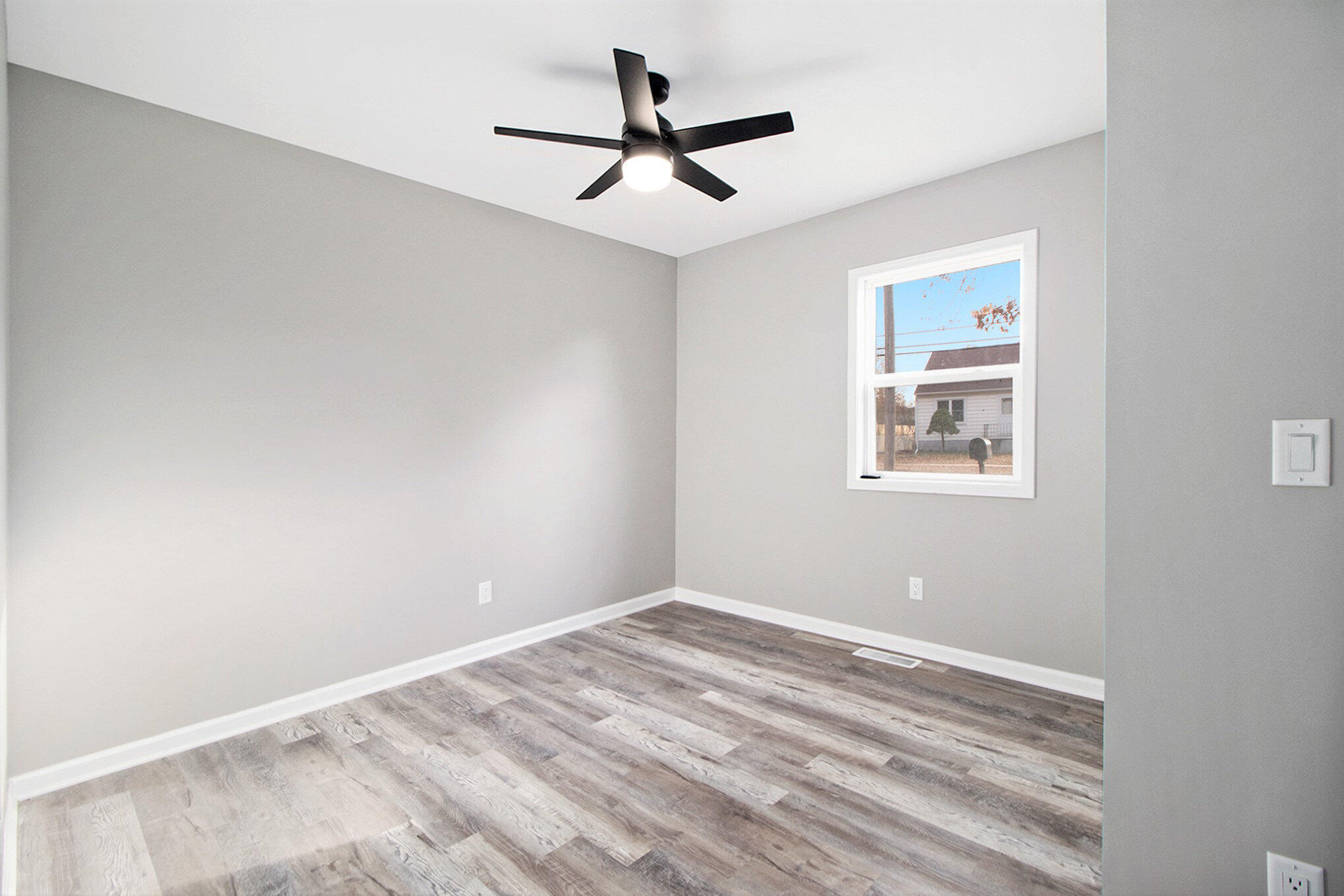 4124 Liverpool Road Lake Station, IN 46405 - Photo 14 of 18 a view of room with window and ceiling fan