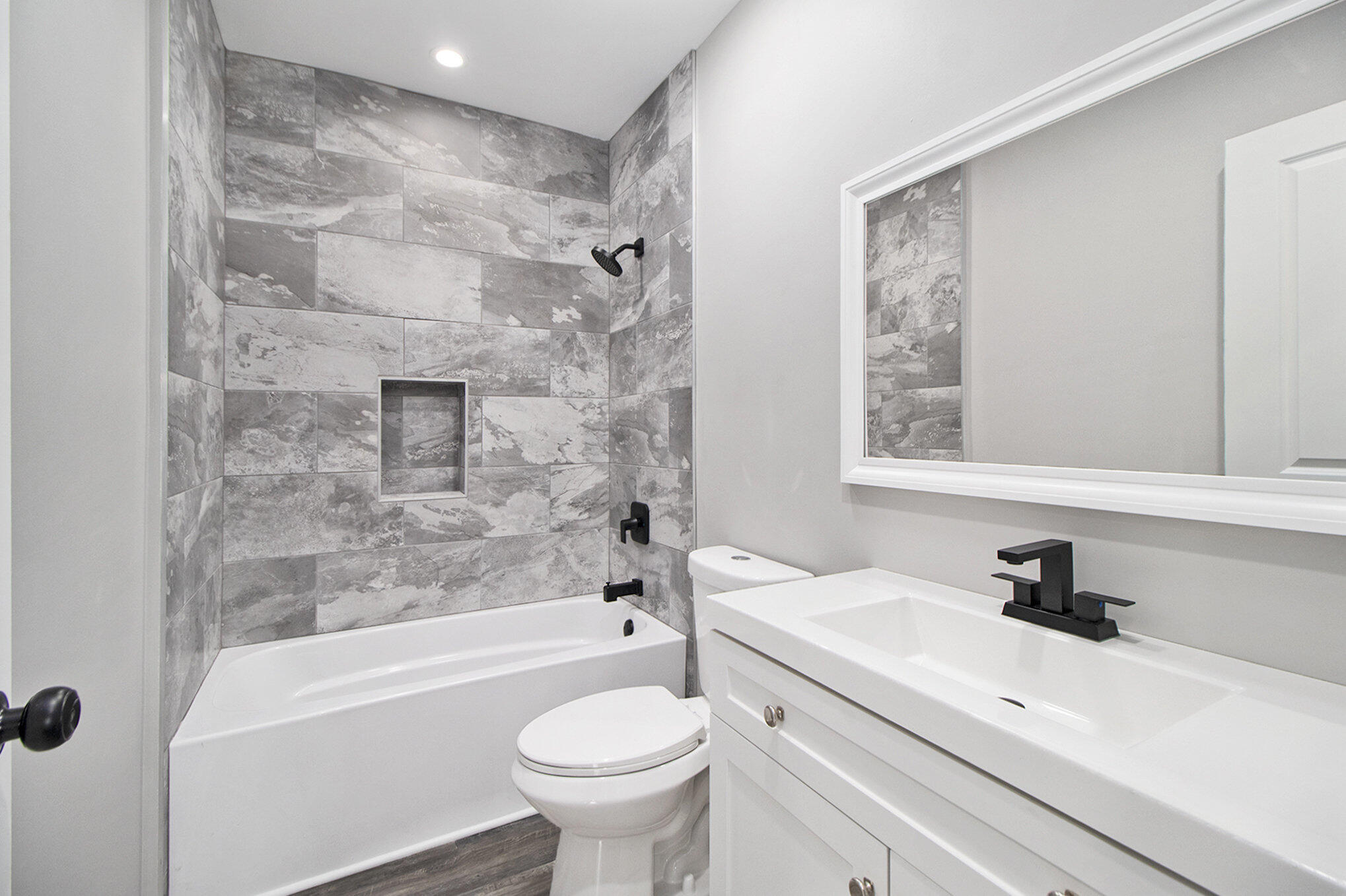 4124 Liverpool Road Lake Station, IN 46405 - Photo 16 of 18 a bathroom with a sink toilet and bathtub