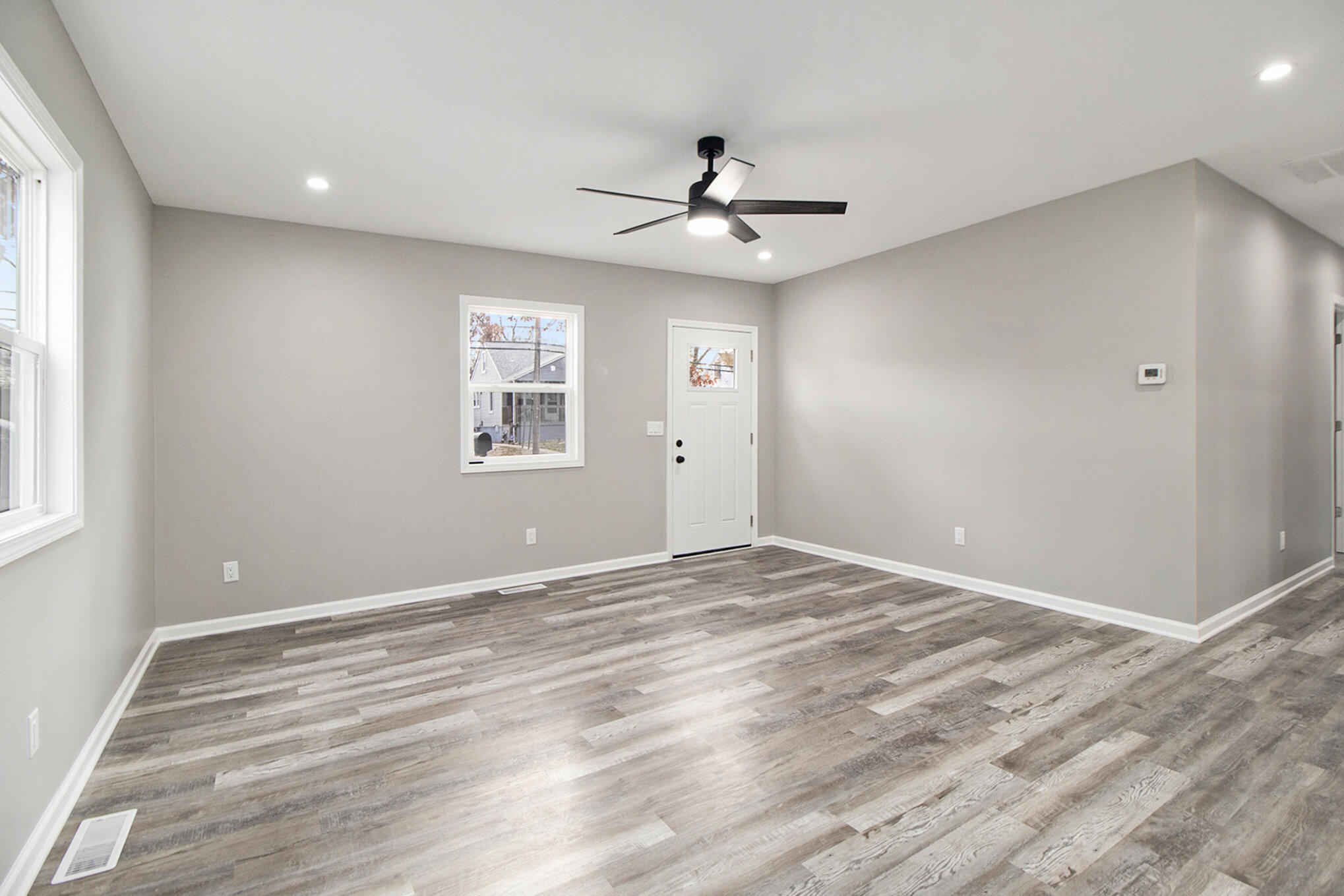 4124 Liverpool Road Lake Station, IN 46405 - Photo 3 of 18 a view of an empty room with a window