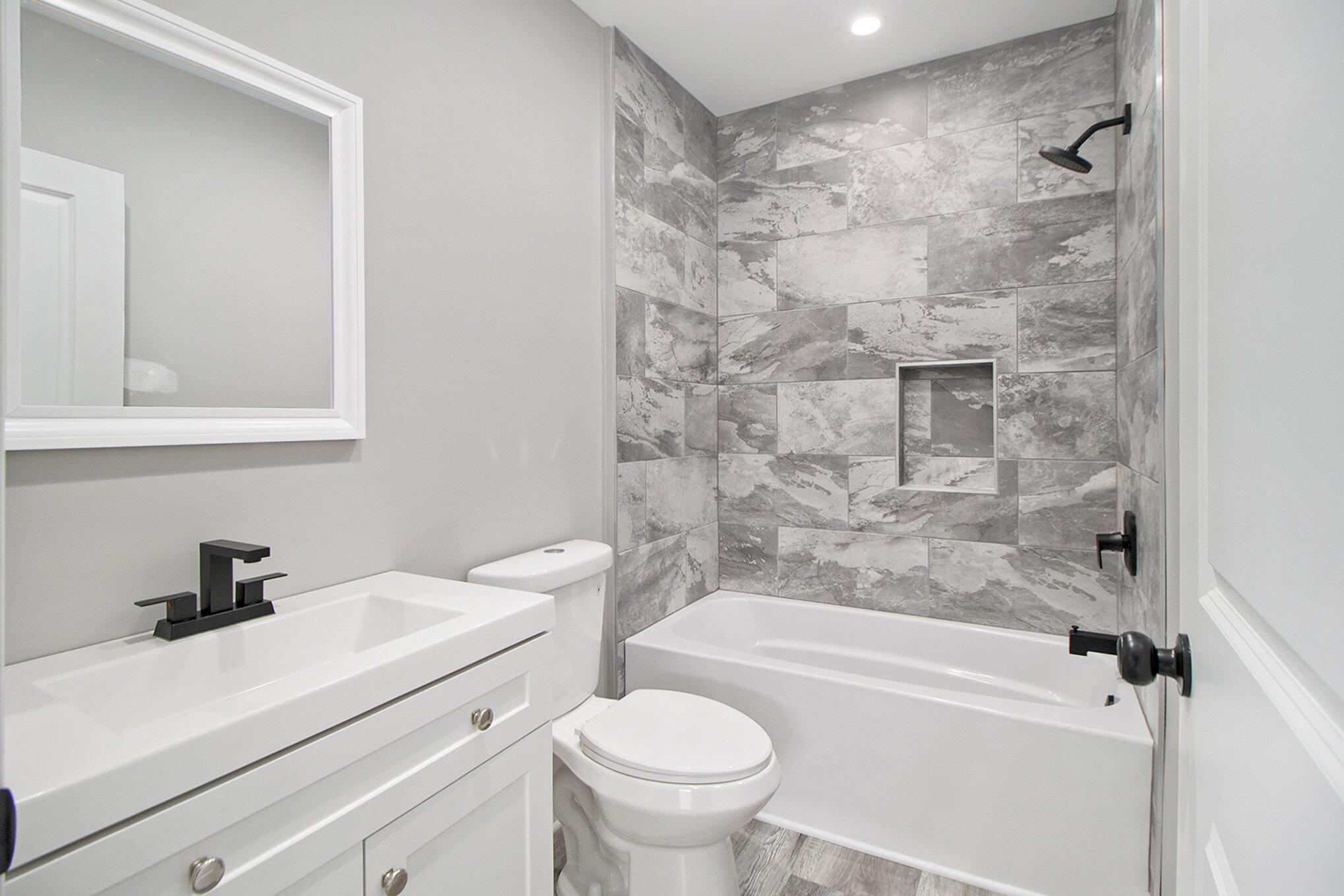 4124 Liverpool Road Lake Station, IN 46405 - Photo 10 of 18 a bathroom with a sink a toilet and a bathtub