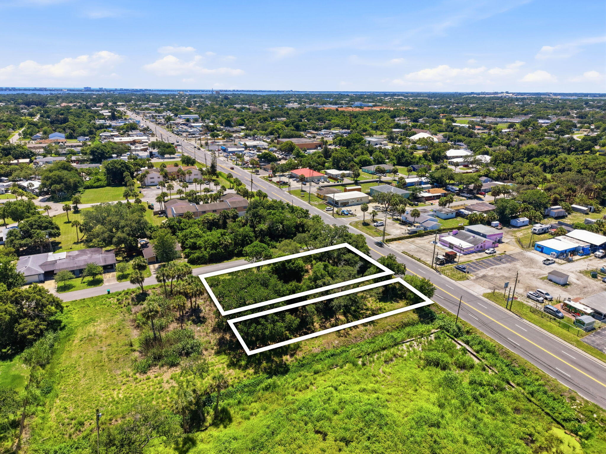 0 Aurora Road Melbourne, FL 32935 - Photo 17 of 20 an aerial view of residential houses with outdoor space