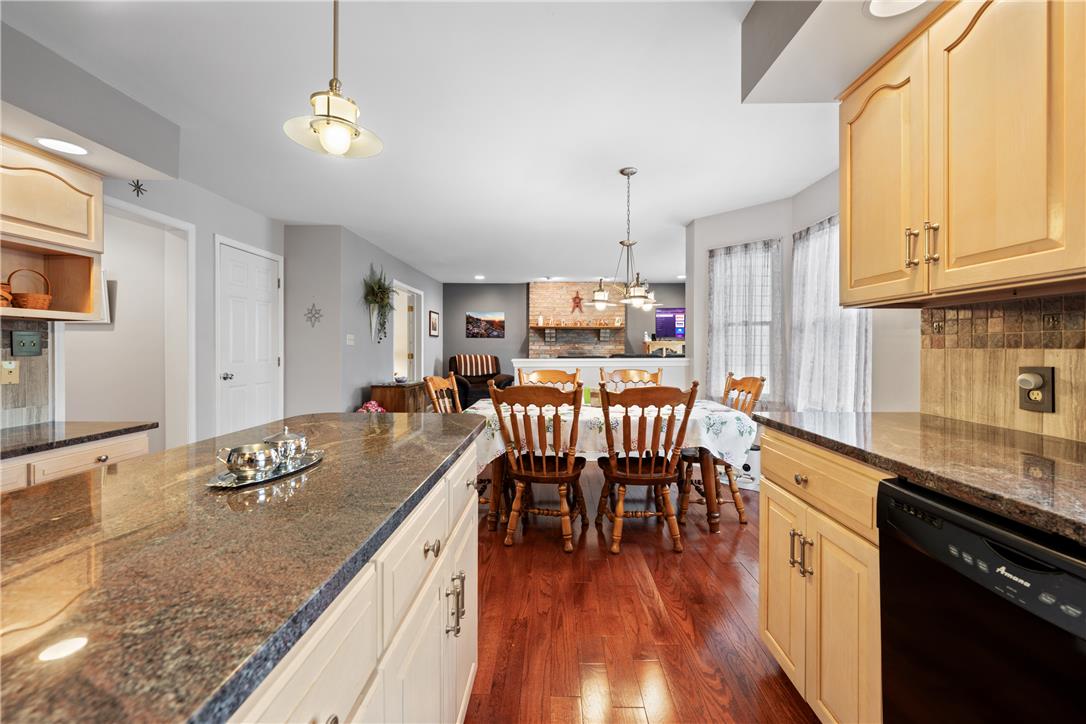 4568 Greenfield Road Bethlehem, PA 18017 - Photo 20 of 59 An inviting open-concept kitchen and dining area feature rich hardwood flooring and ample granite counter space.