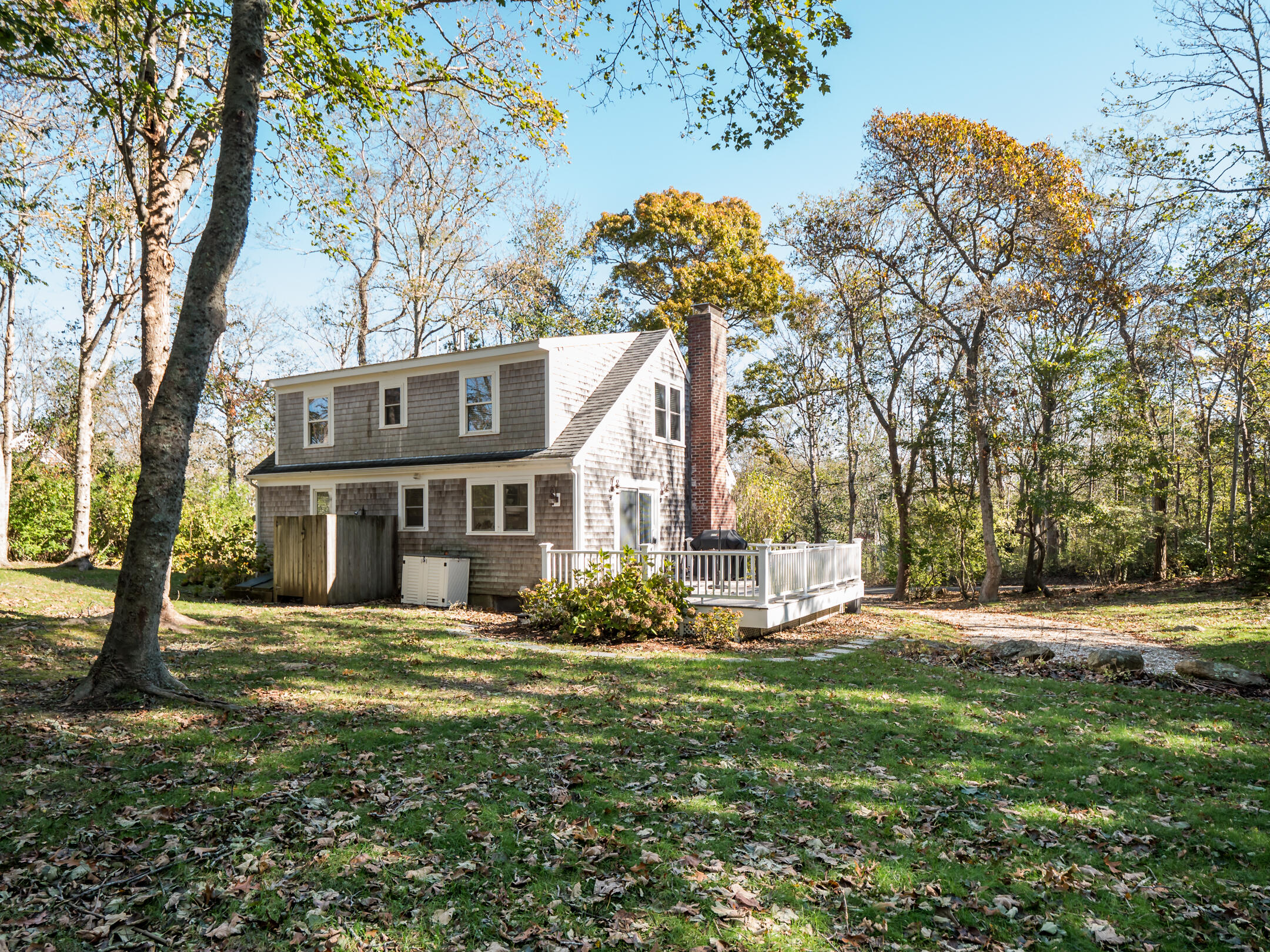 31 Childs Homestead Road Orleans, MA 02653 - Photo 29 of 32 a view of a house with a yard