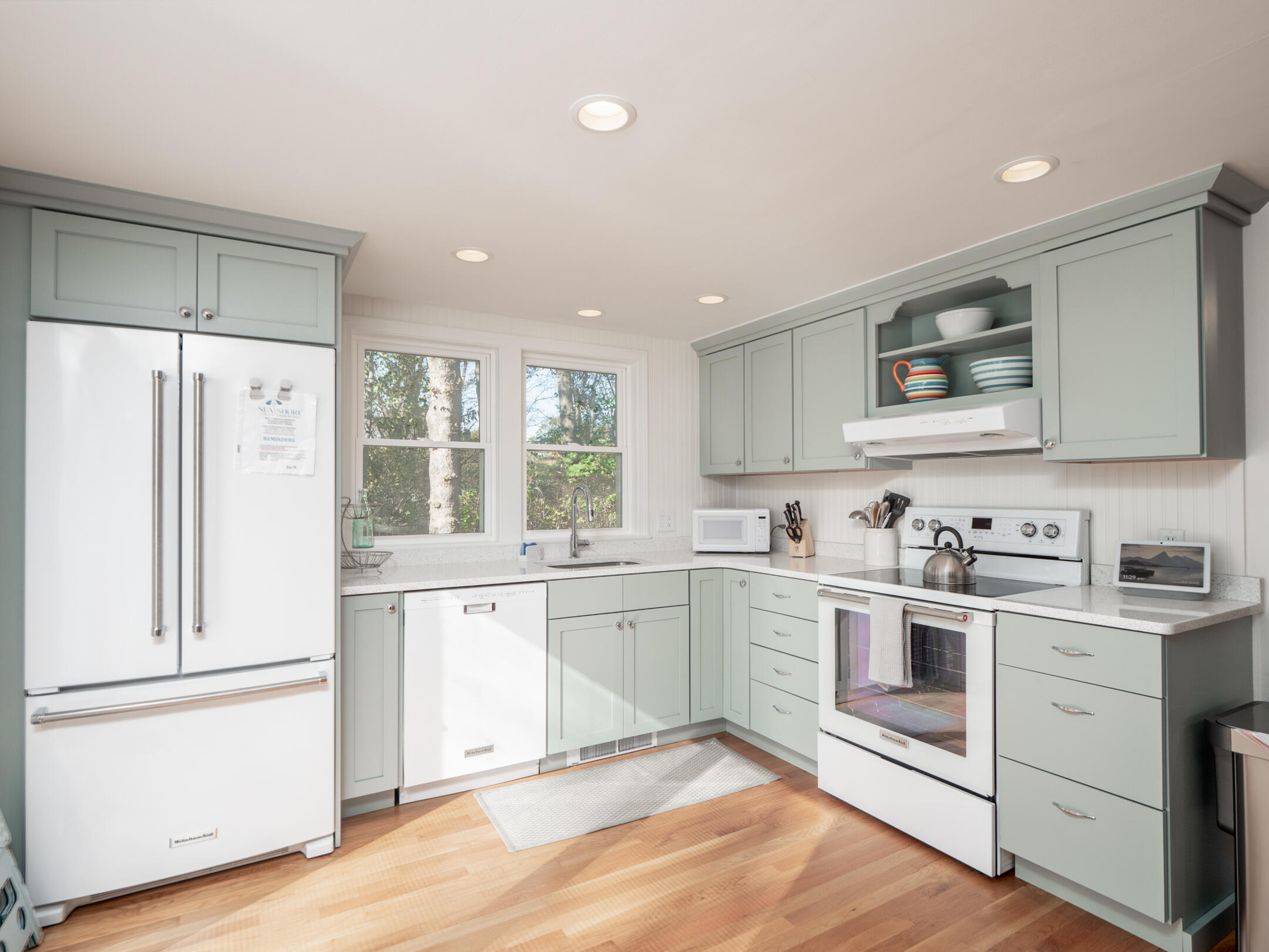 31 Childs Homestead Road Orleans, MA 02653 - Photo 3 of 32 a kitchen with white cabinets and white appliances
