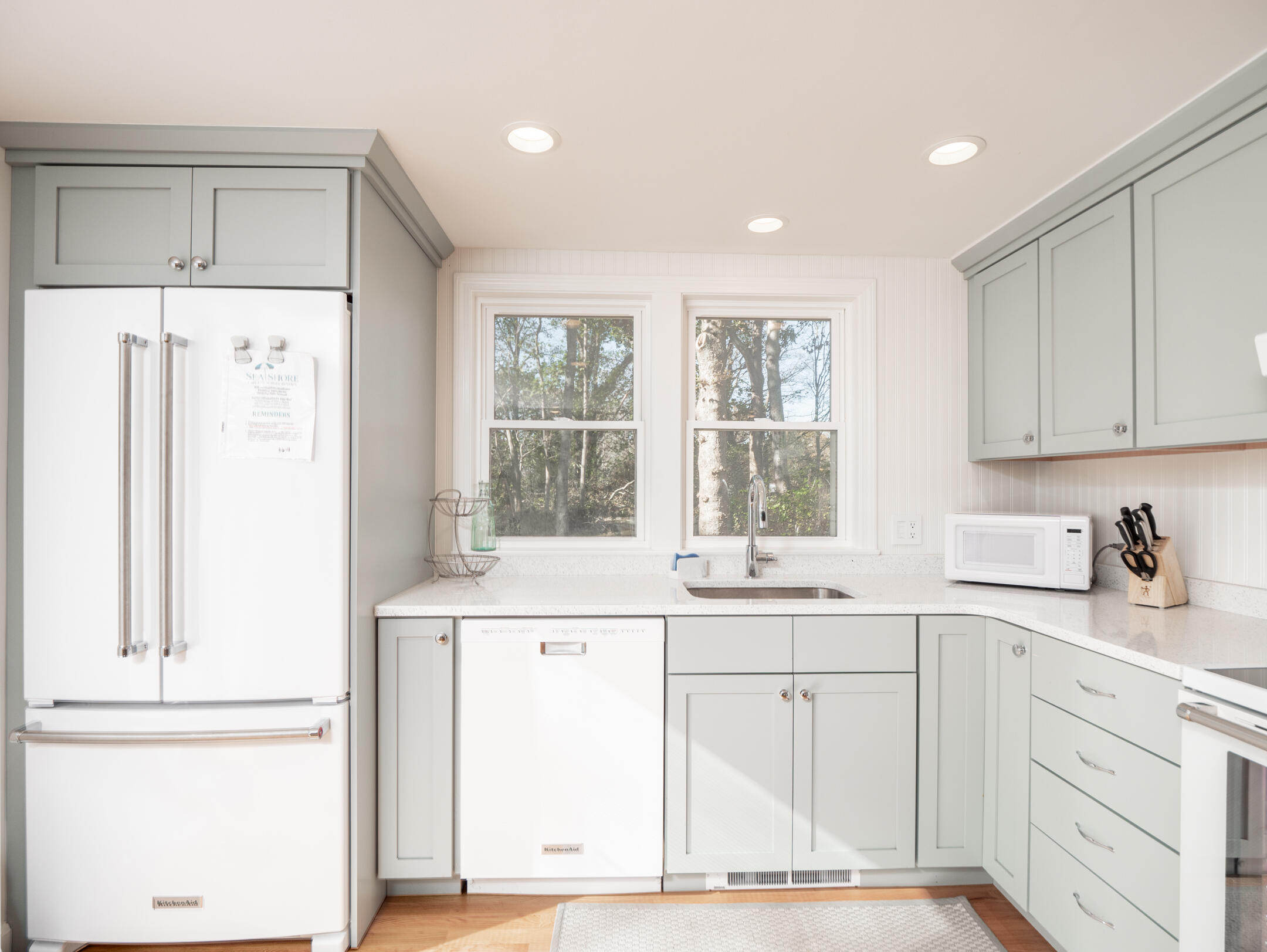 31 Childs Homestead Road Orleans, MA 02653 - Photo 6 of 32 a kitchen with a sink window and cabinets