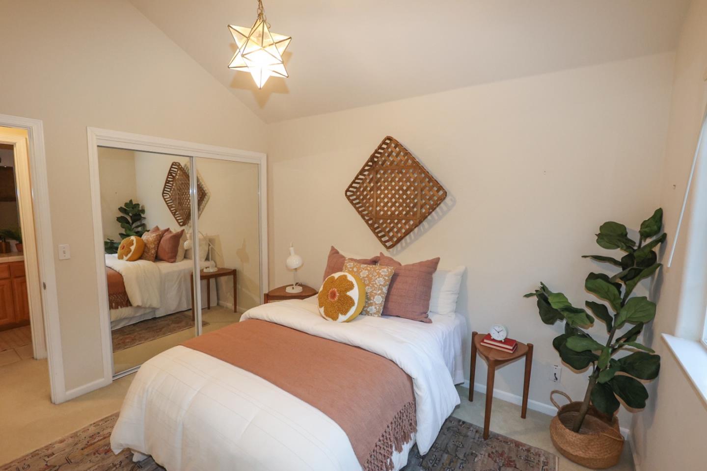 3372 Aptos Rancho Road Aptos, CA 95003 - Photo 19 of 40 a bedroom with a bed and a potted plant