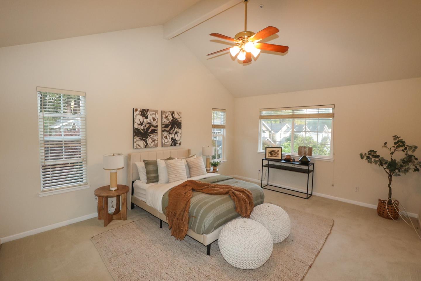 3372 Aptos Rancho Road Aptos, CA 95003 - Photo 22 of 40 a bedroom with a bed and a chandelier