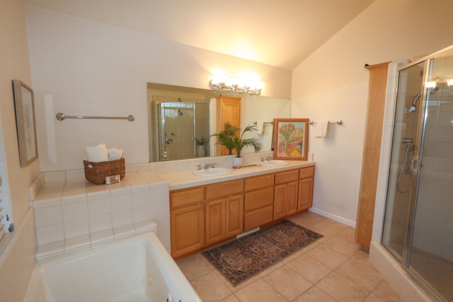 3372 Aptos Rancho Road Aptos, CA 95003 - Photo 26 of 40 a bathroom with a double vanity sink a mirror and a shower