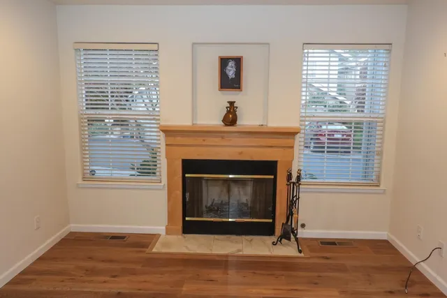 a view of kitchen with sink and fireplace