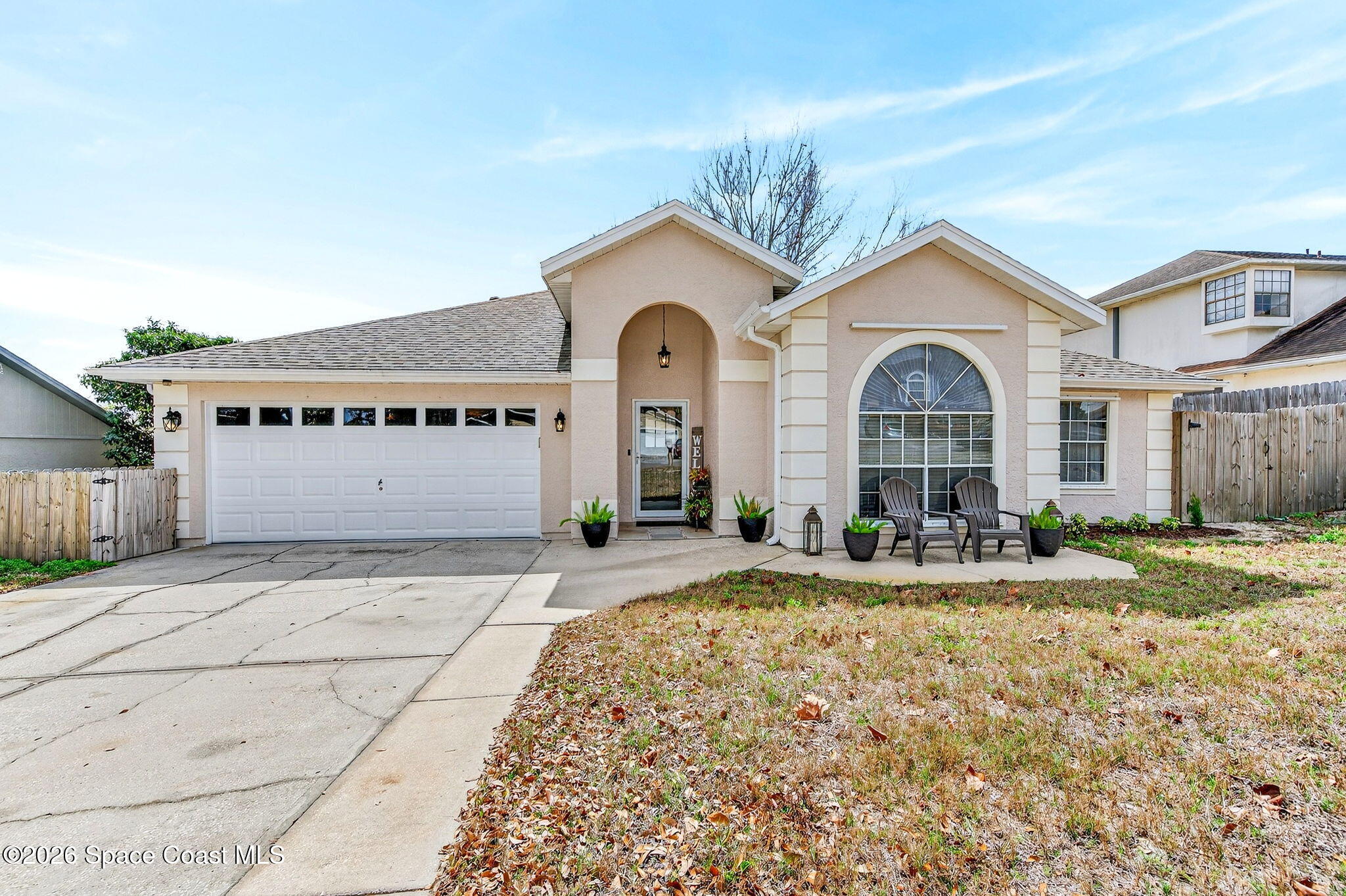 3969 Ridgewood Drive Titusville, FL 32796 - Photo 1 of 34 a front view of a house with a yard