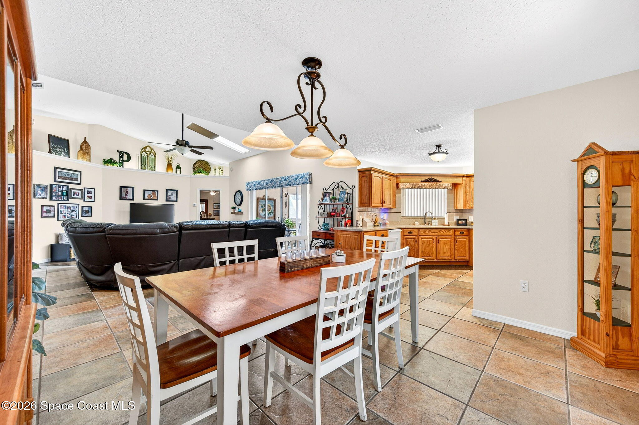 3969 Ridgewood Drive Titusville, FL 32796 - Photo 12 of 34 a dining room with furniture and wooden floor