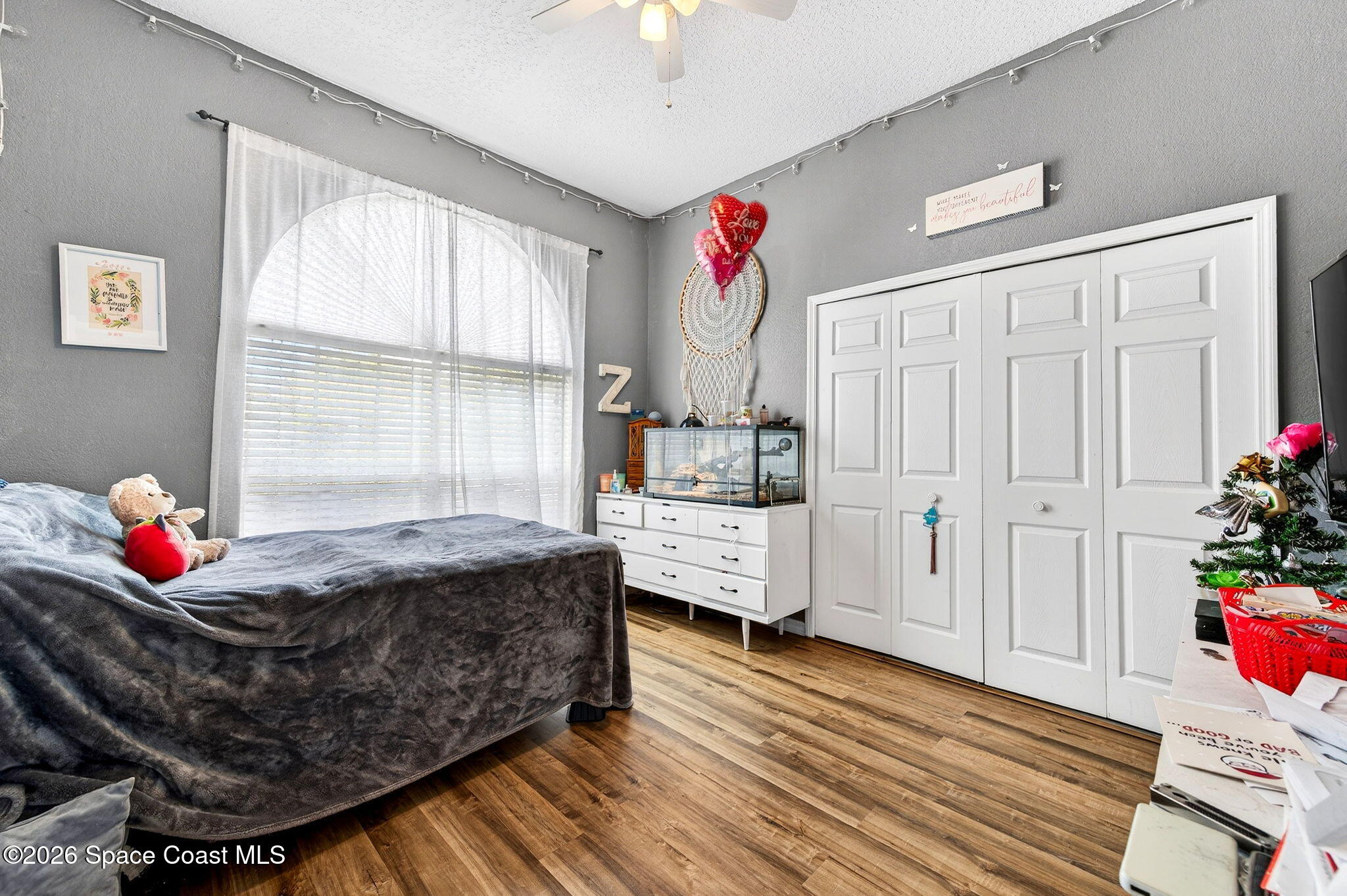 3969 Ridgewood Drive Titusville, FL 32796 - Photo 25 of 34 a bed room with furniture and window