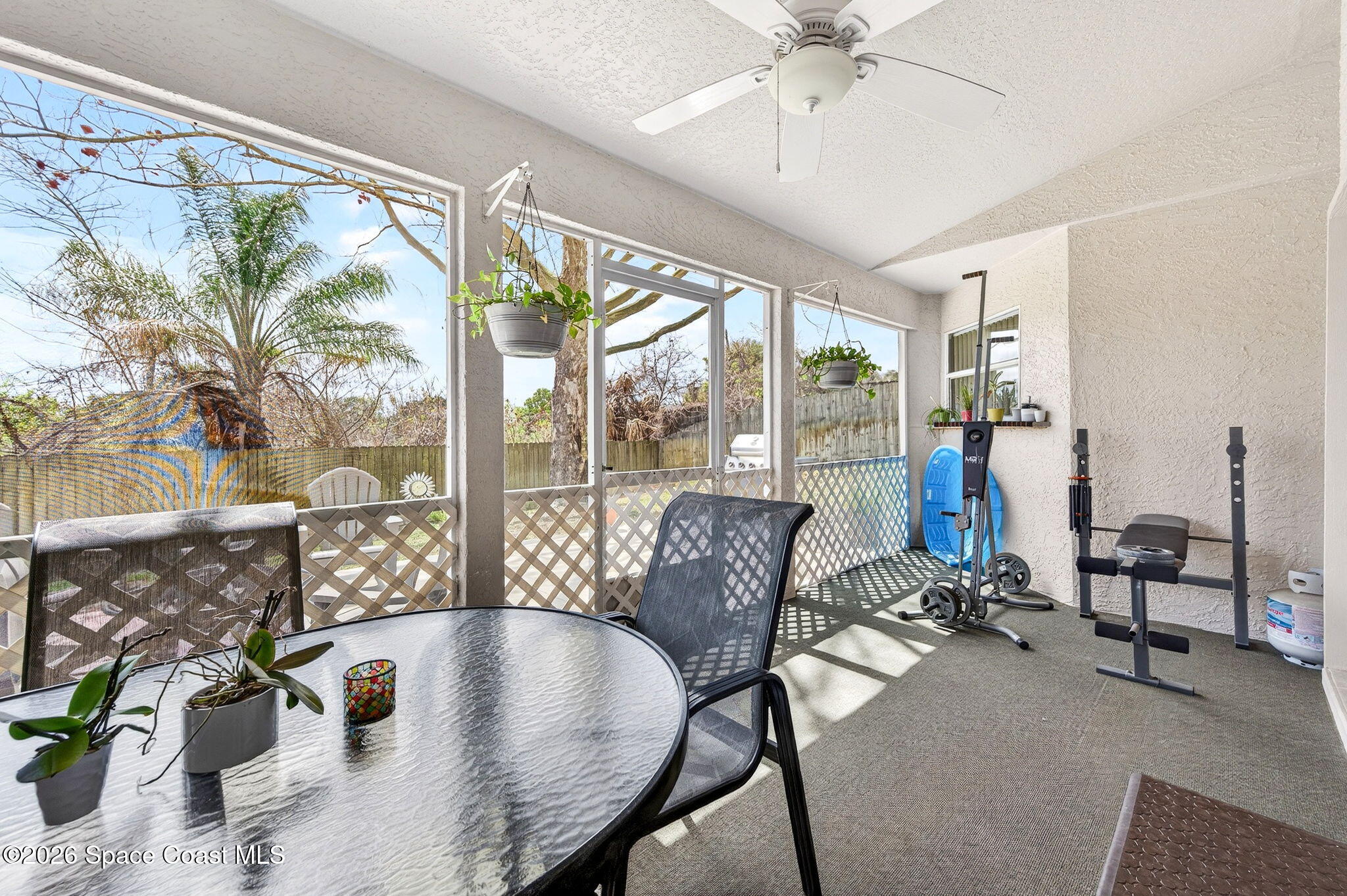 3969 Ridgewood Drive Titusville, FL 32796 - Photo 27 of 34 a living room with furniture and floor to ceiling windows