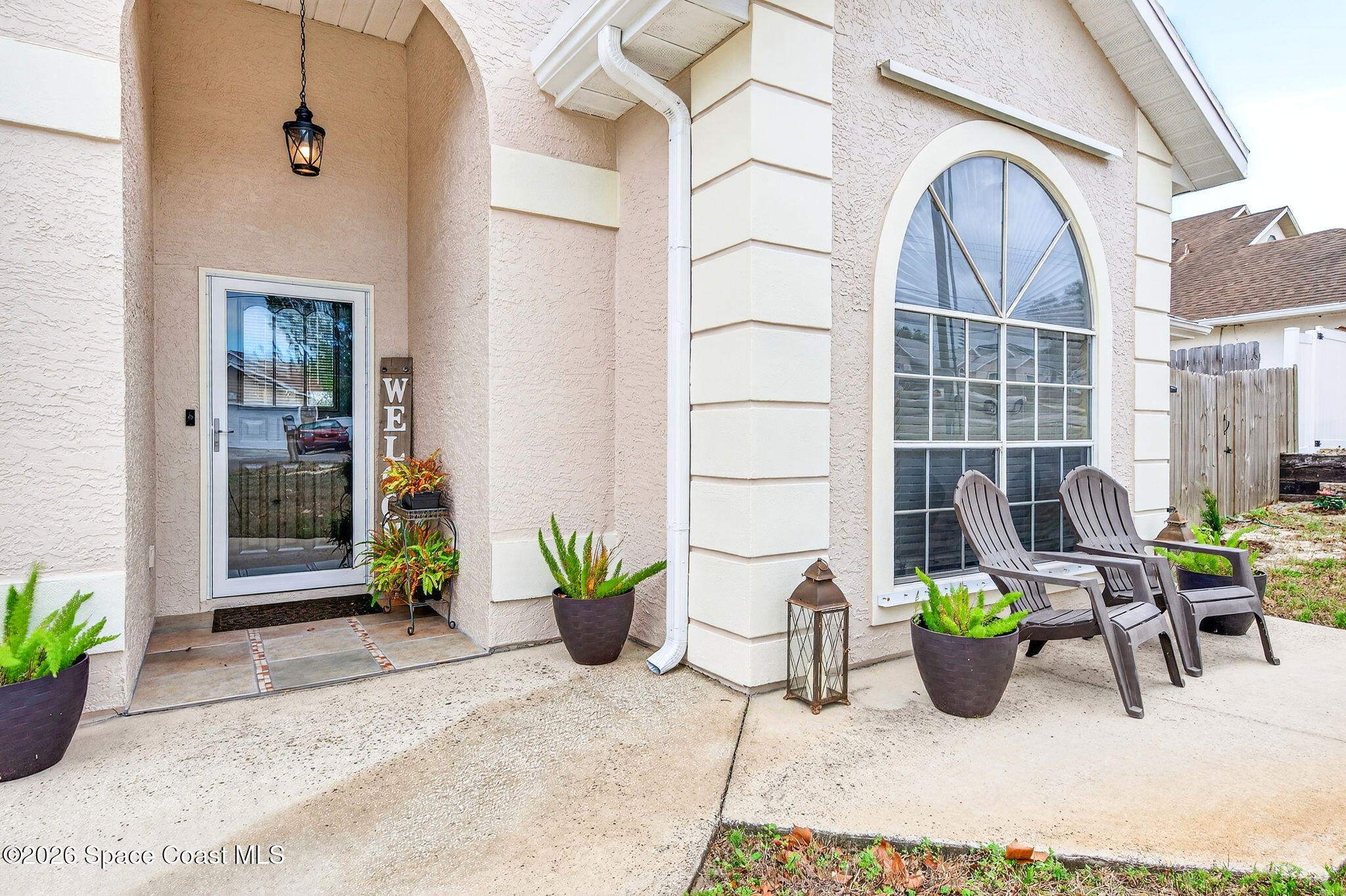 3969 Ridgewood Drive Titusville, FL 32796 - Photo 3 of 34 a view of a chairs and table in a patio