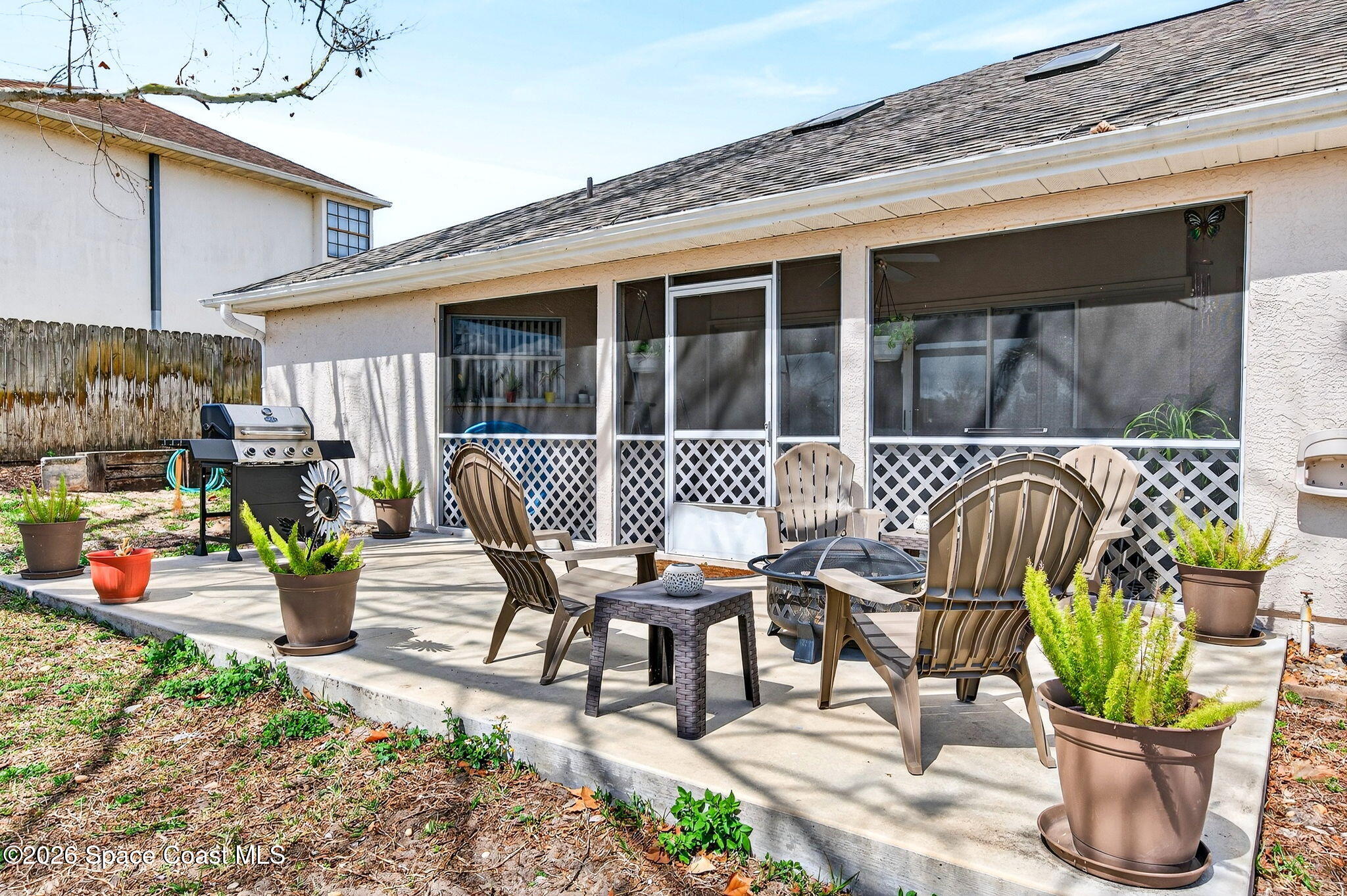 3969 Ridgewood Drive Titusville, FL 32796 - Photo 32 of 34 a view of a chairs and table in patio