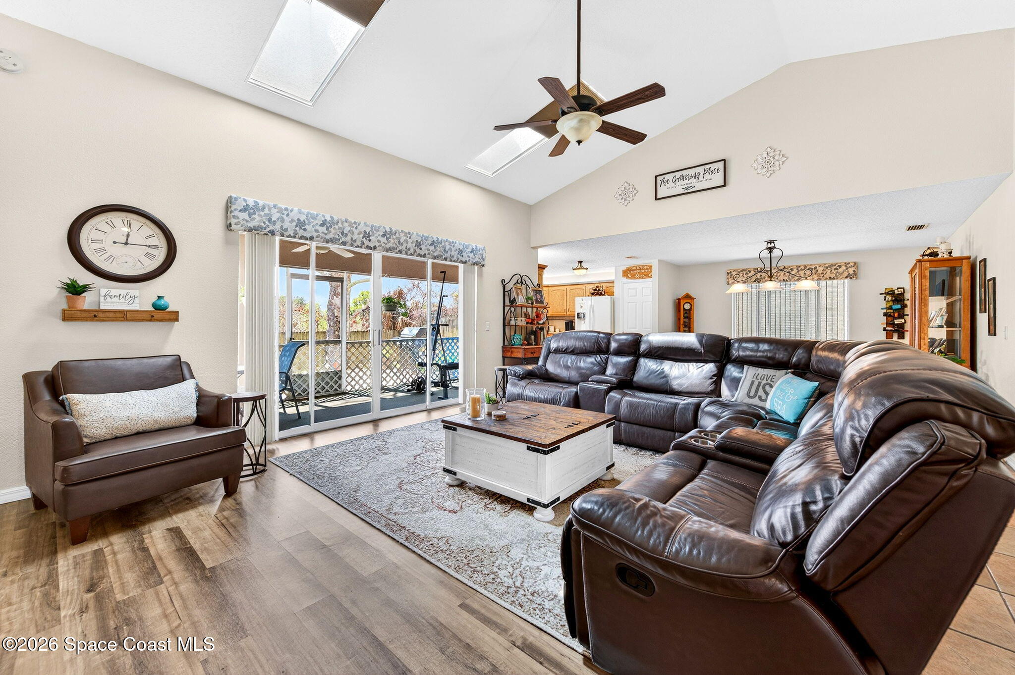 3969 Ridgewood Drive Titusville, FL 32796 - Photo 6 of 34 a living room with furniture a rug and wooden floor