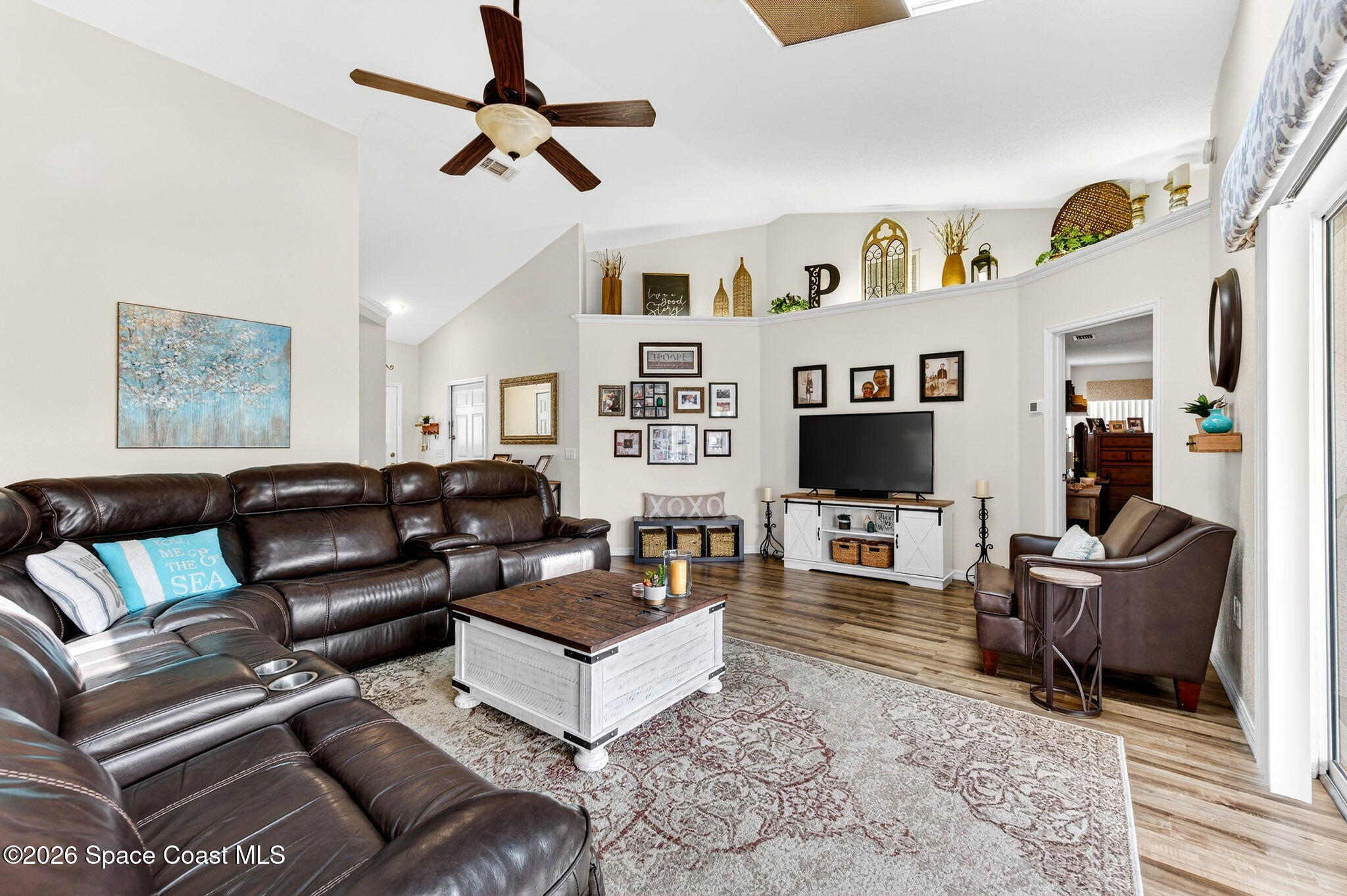 3969 Ridgewood Drive Titusville, FL 32796 - Photo 8 of 34 a living room with furniture and a flat screen tv
