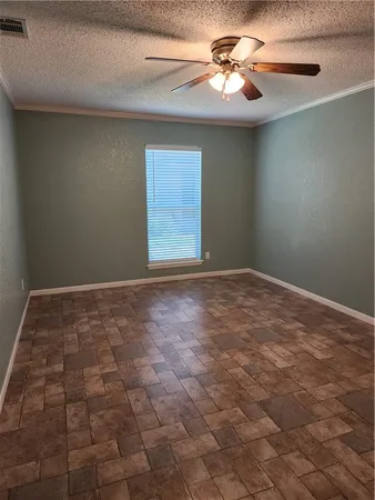 a view of an empty room with windows