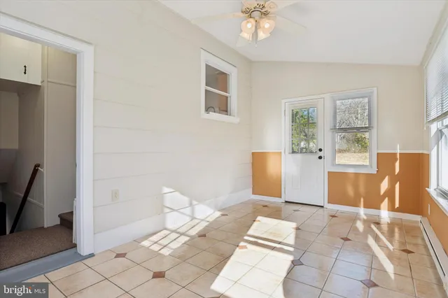 a living room with a couch and a rug