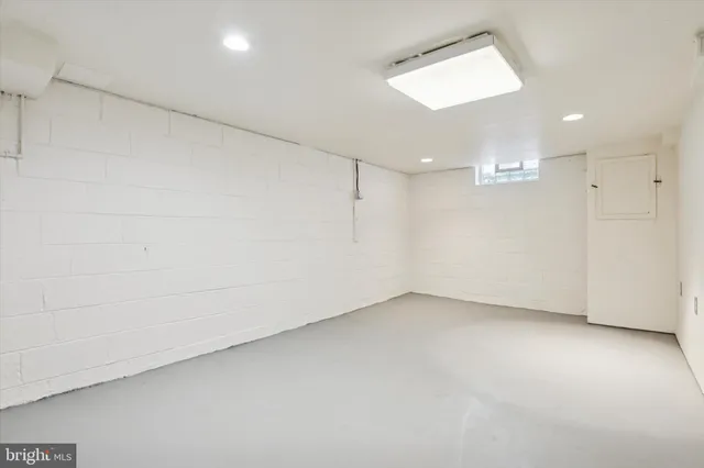 an empty room with a empty space and a window