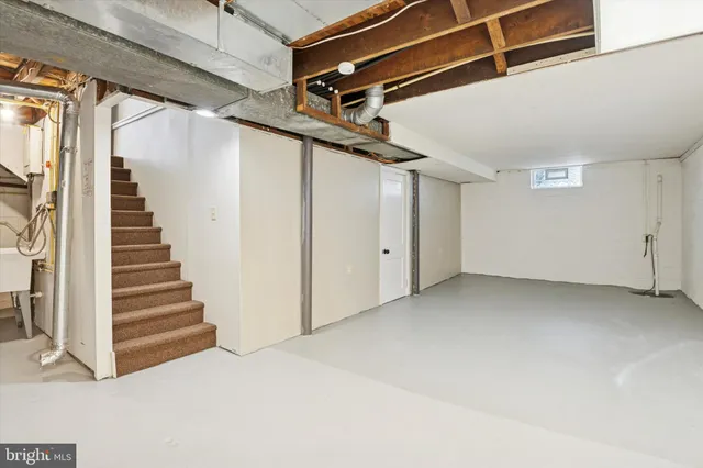 a view of staircase with white walls
