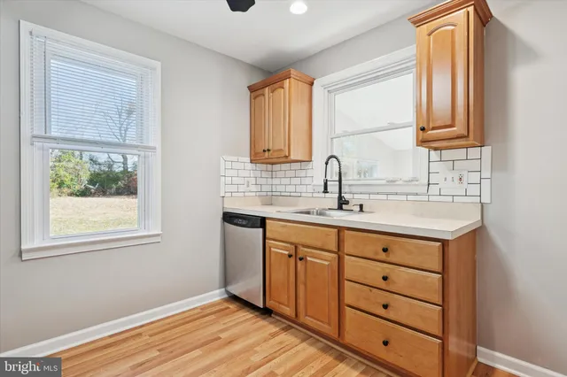 a bathroom with a sink double vanity and a window