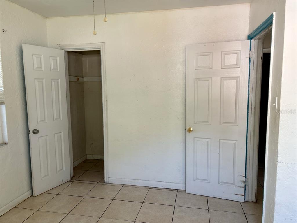 264 14th Street Northwest Largo, FL 33770 - Photo 9 of 12 an empty room with closet area