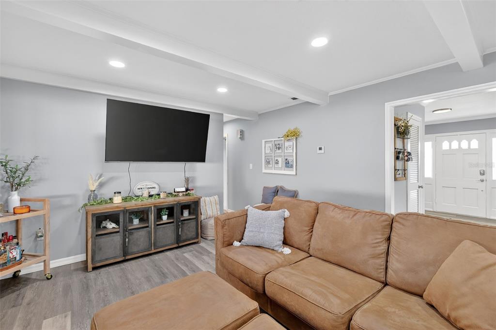 1101 Country Club Road Eustis, FL 32726 - Photo 11 of 44 a living room with furniture and a flat screen tv