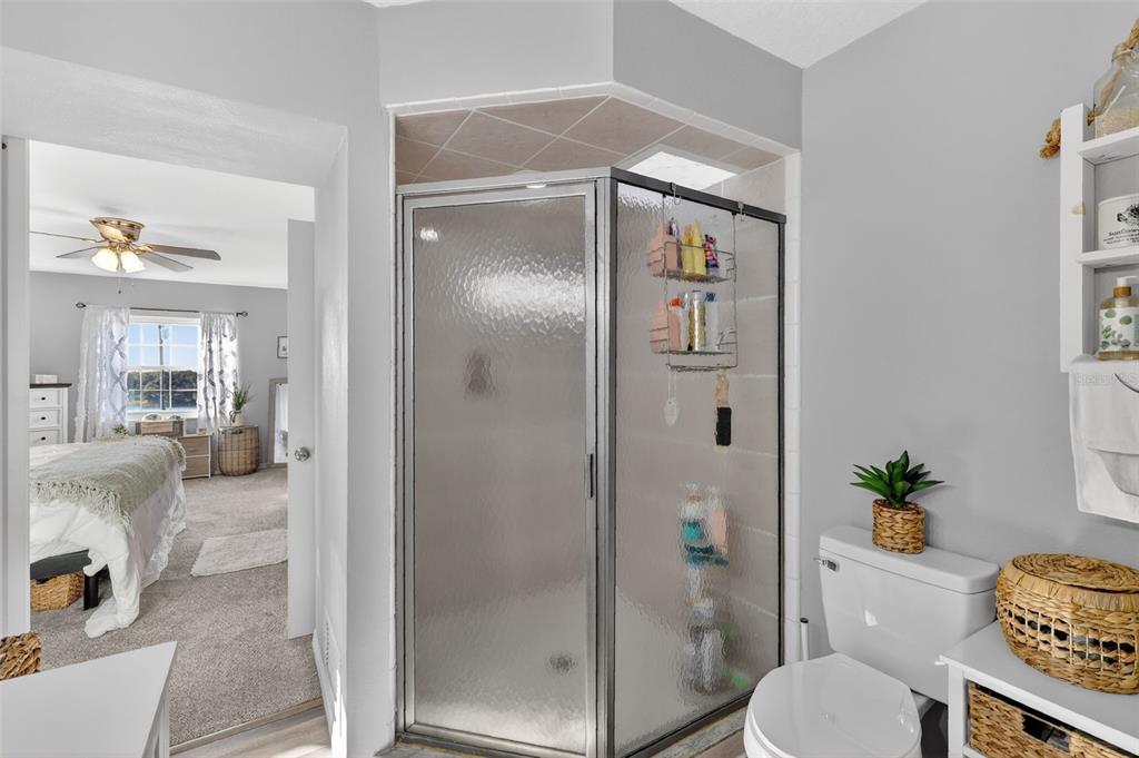 1101 Country Club Road Eustis, FL 32726 - Photo 23 of 44 a bathroom with a shower and a toilet