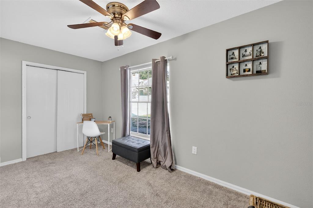 1101 Country Club Road Eustis, FL 32726 - Photo 31 of 44 a living room with furniture and a window