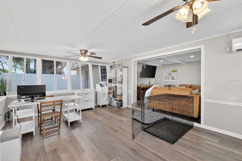 1101 Country Club Road Eustis, FL 32726 - Photo 33 of 44 a bedroom with furniture and a wooden floor