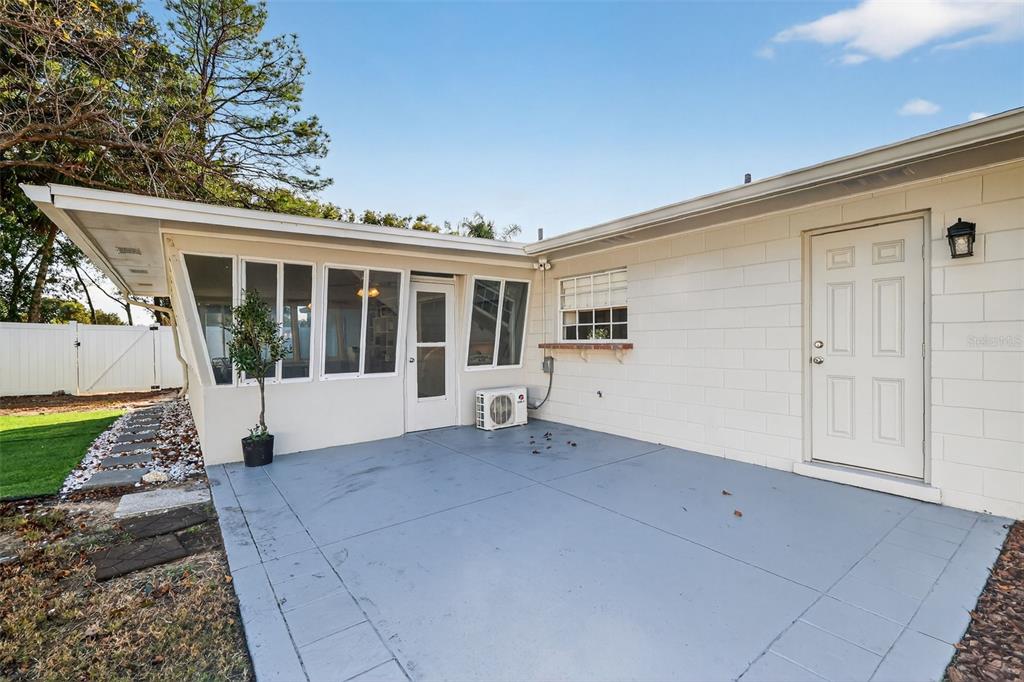 1101 Country Club Road Eustis, FL 32726 - Photo 37 of 44 a view of house with backyard and glass windows