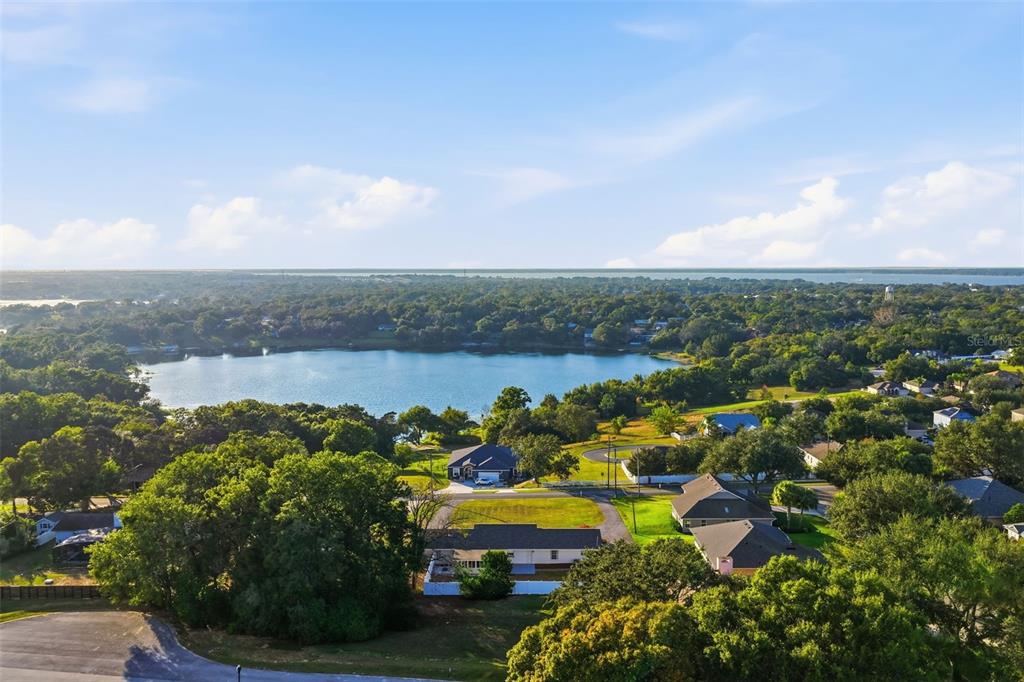 1101 Country Club Road Eustis, FL 32726 - Photo 40 of 44 a view of a lake with houses