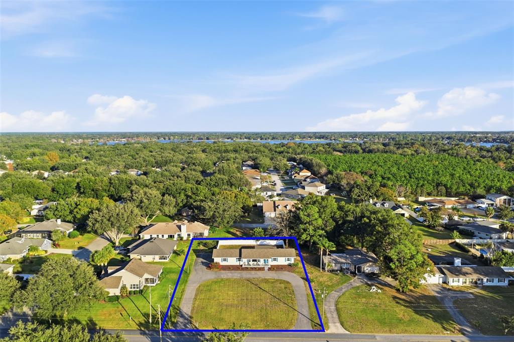 1101 Country Club Road Eustis, FL 32726 - Photo 42 of 44 an aerial view of residential houses with outdoor space